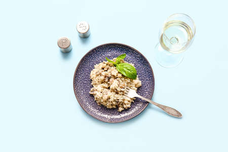 Plate with tasty risotto on color backgroundの写真素材