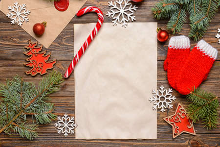 Blank paper for letter to Santa and Christmas decor on wooden backgroundの写真素材