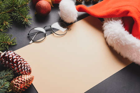 Blank paper for letter to Santa and Christmas decor on dark backgroundの写真素材