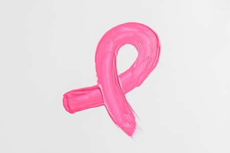 Painted pink ribbon on white background. Breast cancer awareness conceptの写真素材