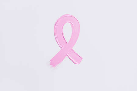 Painted pink ribbon on white background. Breast cancer awareness conceptの写真素材