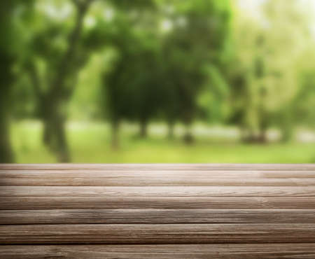 Empty wooden table in parkの写真素材