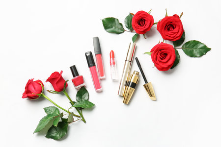 Beautiful red roses and cosmetics on white backgroundの写真素材
