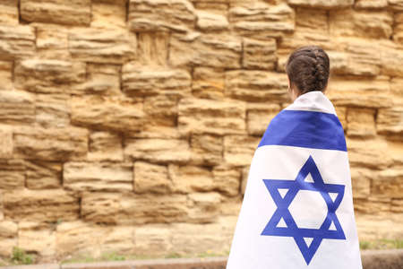 Little girl with the flag of Israel near the Wailing Wallの写真素材