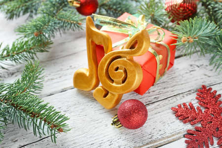 Note signs and Christmas decor on wooden backgroundの写真素材