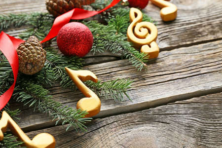 Note signs and Christmas decor on wooden background, closeup