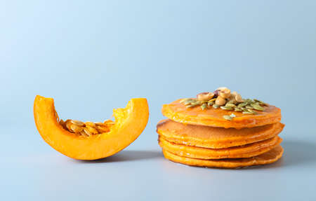 Tasty pumpkin pancakes on gray backgroundの写真素材