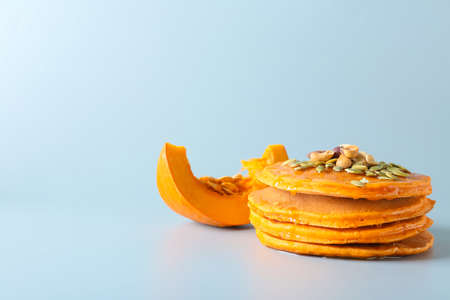Tasty pumpkin pancakes on gray backgroundの写真素材