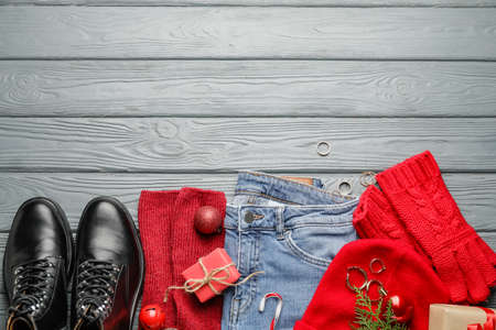 Christmas composition with stylish clothes and accessories on wooden backgroundの写真素材