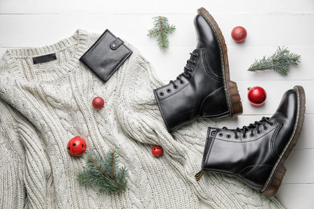 Christmas composition with stylish clothes and accessories on white wooden backgroundの写真素材