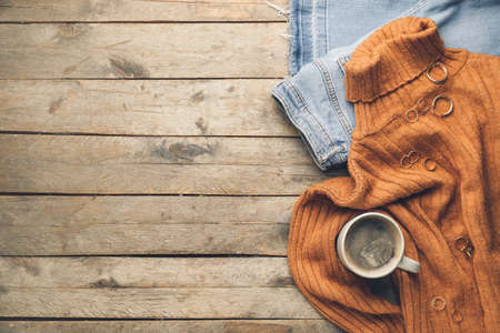 Christmas composition with stylish clothes on wooden backgroundの写真素材