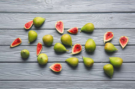 Fresh green figs on wooden background
