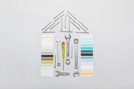 Composition with construction tools and palette samples on light backgroundの写真素材