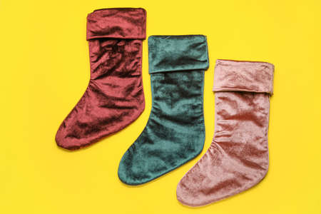 Christmas socks on color backgroundの写真素材