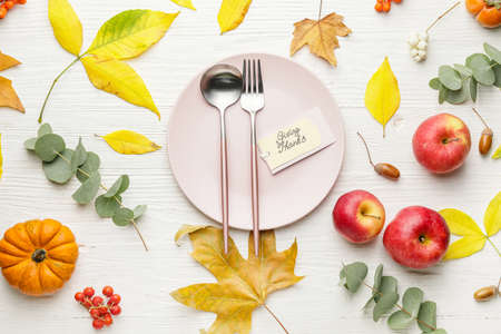 Beautiful table setting for Thanksgiving Day celebration on white wooden backgroundの写真素材