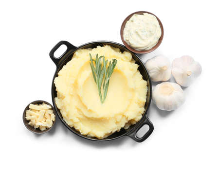 Plate with tasty mashed potatoes and garlic on white background
