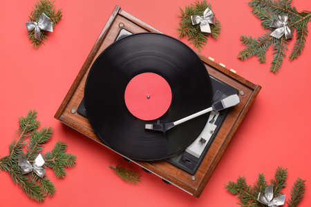 Record player and Christmas decor on color backgroundの写真素材