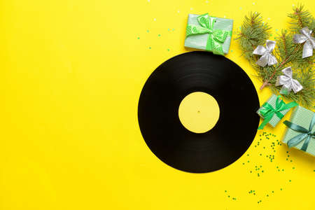 Vinyl disk and Christmas decor on color backgroundの写真素材