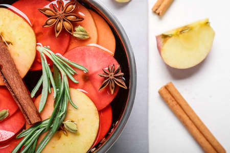 Saucepan with hot mulled wine on table, closeupの写真素材