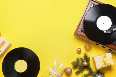 Record player and Christmas decor on color backgroundの写真素材
