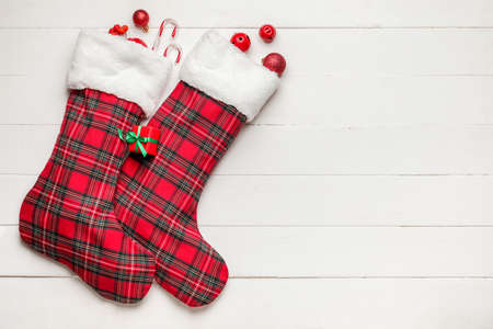 Composition with Christmas socks on white wooden backgroundの写真素材