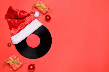 Vinyl disk and Christmas decor on color backgroundの写真素材