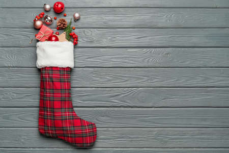 Composition with Christmas sock on wooden backgroundの写真素材