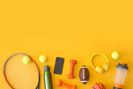 Set of sport equipment on color background