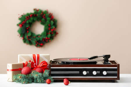 Record player and Christmas decor on tableの写真素材