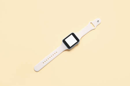 Modern smart watch on color background