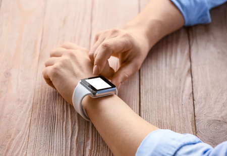 Young woman with modern smart watch, closeupの写真素材