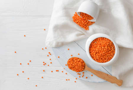 Composition with raw lentils on white wooden tableの写真素材
