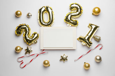 Beautiful New Year composition with blank card on white backgroundの写真素材