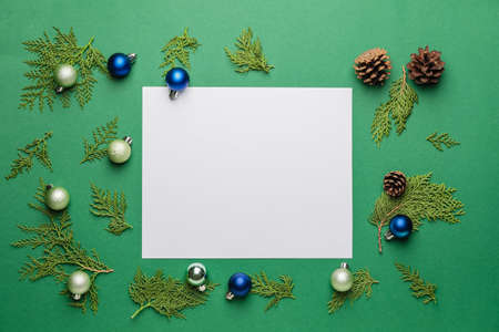 Beautiful Christmas composition with blank card on color backgroundの写真素材