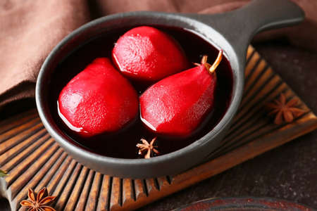 Baking dish of tasty poached pears in wine sauce, closeupの写真素材