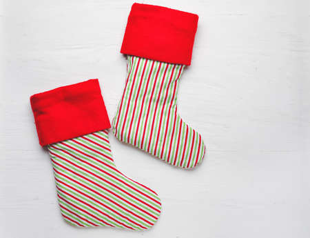 Christmas socks on white wooden background