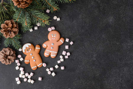 Christmas composition with gingerbread cookies on dark backgroundの写真素材