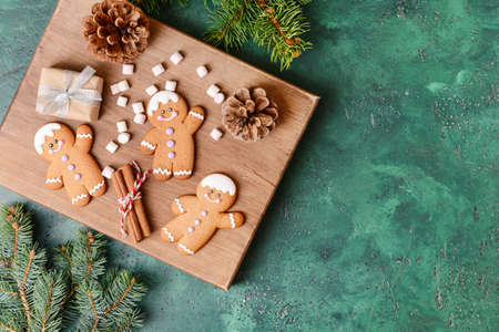 Christmas composition with gingerbread cookies on color backgroundの写真素材