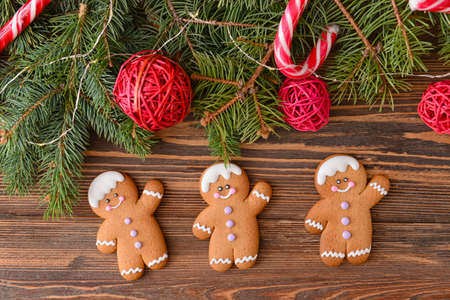 Christmas composition with gingerbread cookies on wooden background