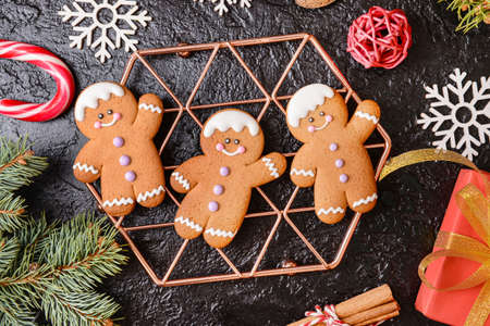 Christmas composition with gingerbread cookies on dark background