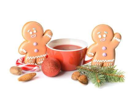 Christmas composition with gingerbread cookies and cup of tea on white backgroundの写真素材