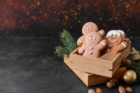 Christmas composition with gingerbread cookies on dark background