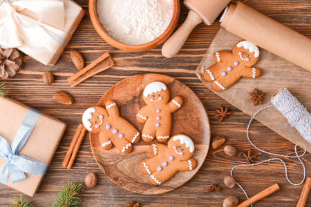Christmas composition with gingerbread cookies on wooden background