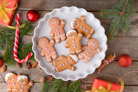 Christmas composition with gingerbread cookies on wooden background
