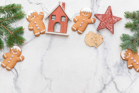 Christmas composition with gingerbread cookies on white background