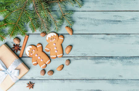 Christmas composition with gingerbread cookies on color wooden backgroundの写真素材