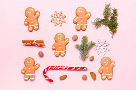 Christmas composition with gingerbread cookies on color backgroundの写真素材