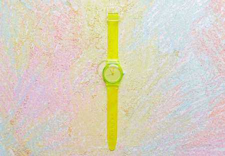 Wrist watch on colorful background