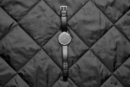 Wrist watch on dark fabric backgroundの写真素材