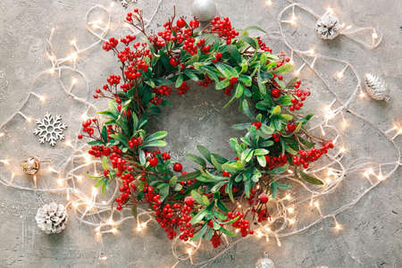 Beautiful Christmas wreath and decor on gray backgroundの写真素材